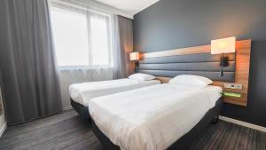 Postel nebo postele na pokoji v ubytování X Hotel