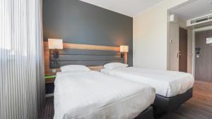 Postel nebo postele na pokoji v ubytování X Hotel