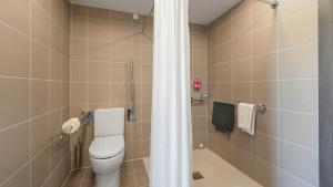 Koupelna v ubytování X Hotel
