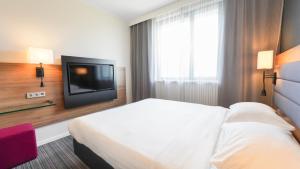 Postel nebo postele na pokoji v ubytování X Hotel