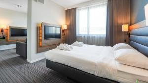 Postel nebo postele na pokoji v ubytování X Hotel