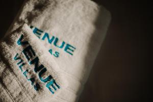 a close up of a white sock with the words ironic asiability at Venue Villas - Folegandros in Áno Meriá