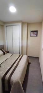 Ένα ή περισσότερα κρεβάτια σε δωμάτιο στο Apartamento EL PAJAR