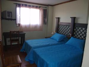 Voodi või voodid majutusasutuse Hotel Rural El Rocal toas