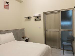 Ein Bett oder Betten in einem Zimmer der Unterkunft Hui Chao Gui Su