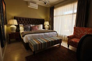 Katil atau katil-katil dalam bilik di Mavuta Boutique Apartments