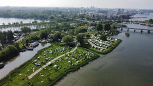 an aerial view of a park next to a river at Camping Zeeburg Amsterdam in Amsterdam