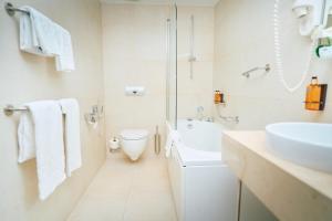Ein Badezimmer in der Unterkunft ASTORIA Hotel Opatija