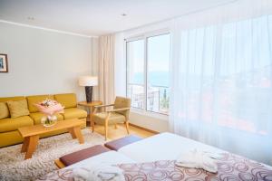 Postel nebo postele na pokoji v ubytování ASTORIA Hotel Opatija