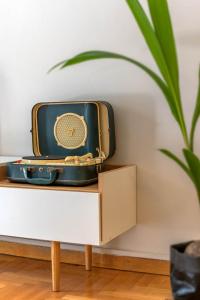 a suitcase sitting on top of a table at Empyrean Apartment in Athens