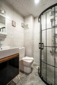 a bathroom with a toilet and a sink and a shower at York House İstanbul in Istanbul +48 photos