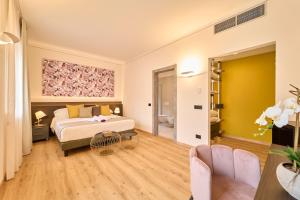 Postel nebo postele na pokoji v ubytování Hotel Villa Cuserina