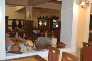 a dining room with tables and chairs in a room at Motel Stovrela in Cazin +20 photos