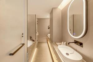 Koupelna v ubytování Tunchang Xiangshan Yunju Hotel + 24 fotografií