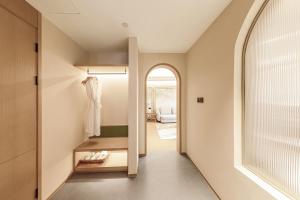 Postel nebo postele na pokoji v ubytování Tunchang Xiangshan Yunju Hotel