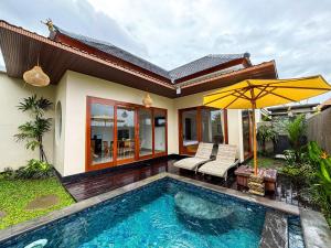 a villa with a swimming pool and a house at Obah Villa Ubud 1 Br Brand new private villa in Ubud