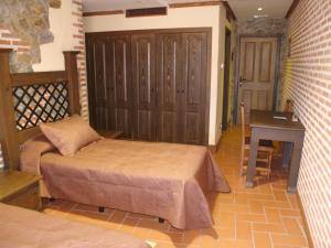 Voodi või voodid majutusasutuse Hotel Rural El Rocal toas