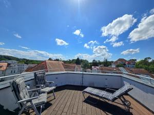 Ein Balkon oder eine Terrasse in der Unterkunft Strandvillen Binz - Ferienwohnung mit Panoramablick, 2 Schlafzimmern und Balkon SV-715