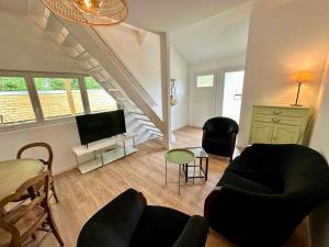 Μια τηλεόραση ή/και κέντρο ψυχαγωγίας στο Villa Merlibeach - 3 logements 4 personnes