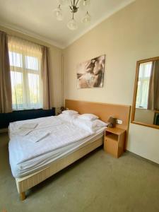 Posteľ alebo postele v izbe v ubytovaní Pető Apartman