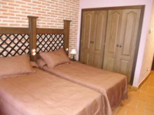 Voodi või voodid majutusasutuse Hotel Rural El Rocal toas