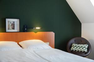 Postel nebo postele na pokoji v ubytování ACHAT Hotel Heppenheim