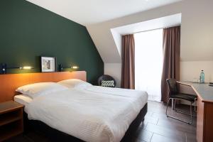 Postel nebo postele na pokoji v ubytování ACHAT Hotel Heppenheim