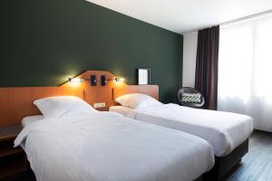 Postel nebo postele na pokoji v ubytování ACHAT Hotel Heppenheim