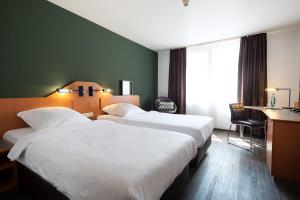 Postel nebo postele na pokoji v ubytování ACHAT Hotel Heppenheim