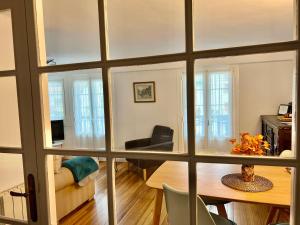 a view of a living room from a window at Portukoetxea - Basquenjoy in Hondarribia