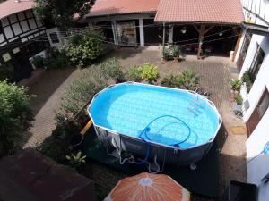 a swimming pool in a yard with a house at Alte Posthalterei in Stolberg