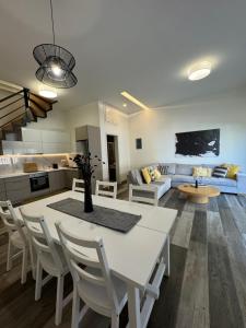 A television and/or entertainment centre at Aelia Luxury Beach House