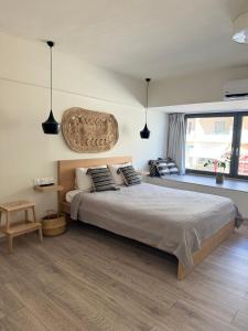 A bed or beds in a room at Aelia Luxury Beach House