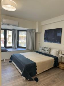 A bed or beds in a room at Aelia Luxury Beach House