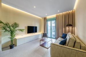 Televízia a/alebo spoločenská miestnosť v ubytovaní SUNSET MALAGA - PRIME & DESIGN