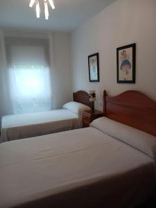 Postel nebo postele na pokoji v ubytování Piso Sanxenxo + 4 fotografie