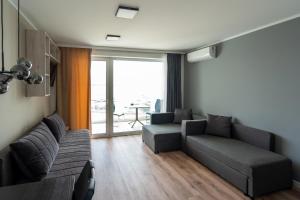 Posezení v ubytování OW Mewa domki apartamenty nad jeziorem
