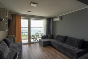 Posezení v ubytování OW Mewa domki apartamenty nad jeziorem