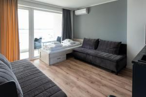 Posezení v ubytování OW Mewa domki apartamenty nad jeziorem