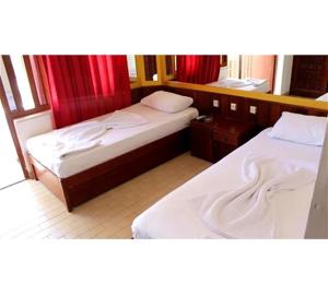 Ένα ή περισσότερα κρεβάτια σε δωμάτιο στο Meşe Hotel