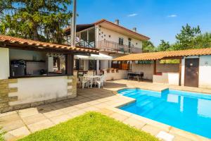 a backyard with a swimming pool and a house at Etna's boat house in Piedimonte Etneo