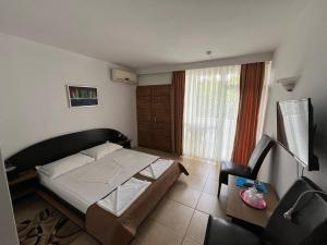 Postel nebo postele na pokoji v ubytování Hotel Metropol