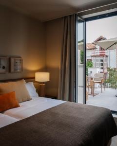 Postel nebo postele na pokoji v ubytování Hotel Rhin Garden