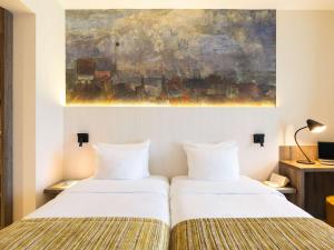 Кровать или кровати в номере Mercure Oostende
