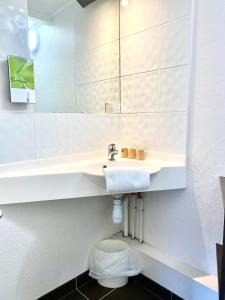 Koupelna v ubytování Brit Hotel Lyon Nord Dardilly