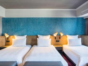 Ein Bett oder Betten in einem Zimmer der Unterkunft Swissotel Nankai Osaka