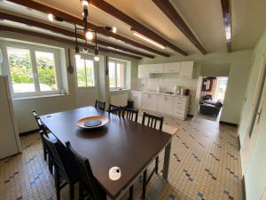 a kitchen and dining room with a table and chairs at Gite 3 Les Epesses in Les Épesses
