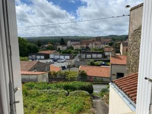 a view from a window of a town with roofs at Gite 3 Les Epesses in Les Épesses