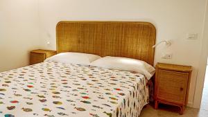 Postel nebo postele na pokoji v ubytování Residence Duna Rossa - Family Friendly