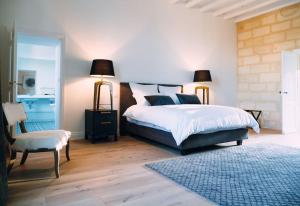 Ένα ή περισσότερα κρεβάτια σε δωμάτιο στο Chateau La Clariere